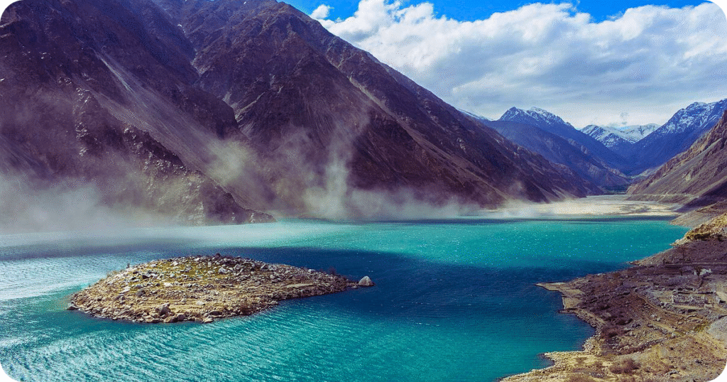 “Scenic Satpara Lake reflecting the surrounding valley and hills in Skardu.”