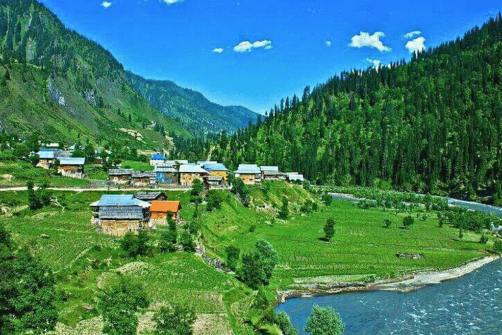 “Scenic view of Hunza Valley with mountains and lush greenery, one of the most visited places in Pakistan.”