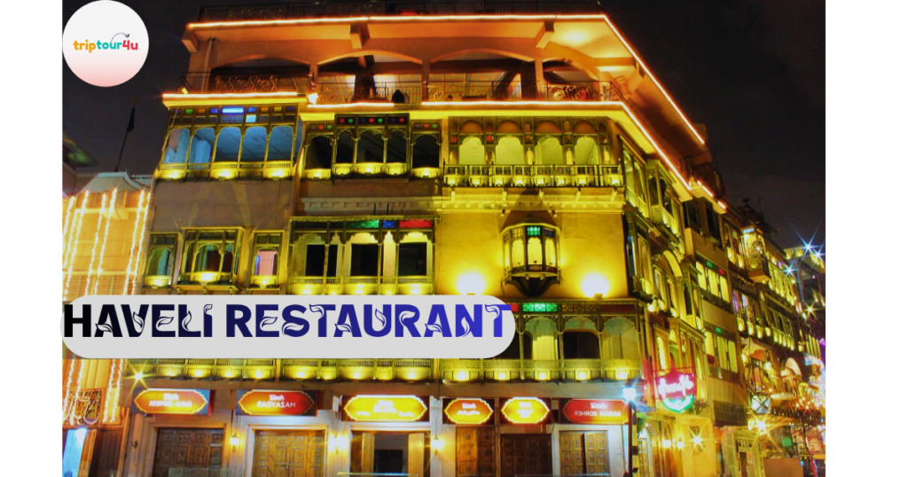 Haveli Restaurant at night in Lahore, a historic multi-story building illuminated with warm lights along Fort Road Food Street near Badshahi Mosque.