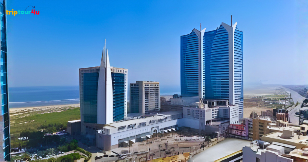 Dolmen Mall Clifton in Karachi, featuring the modern shopping mall exterior near the coastline with contemporary architecture and a busy urban surroundings.