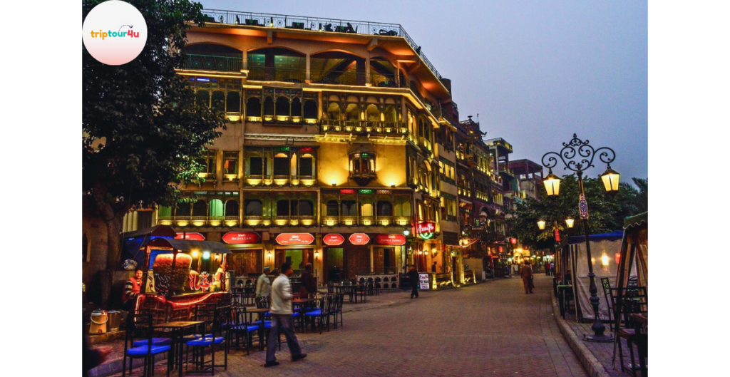 Night view of Fort Road Food Street Lahore featuring vibrant lights, restaurants, and a lively food atmosphere.
