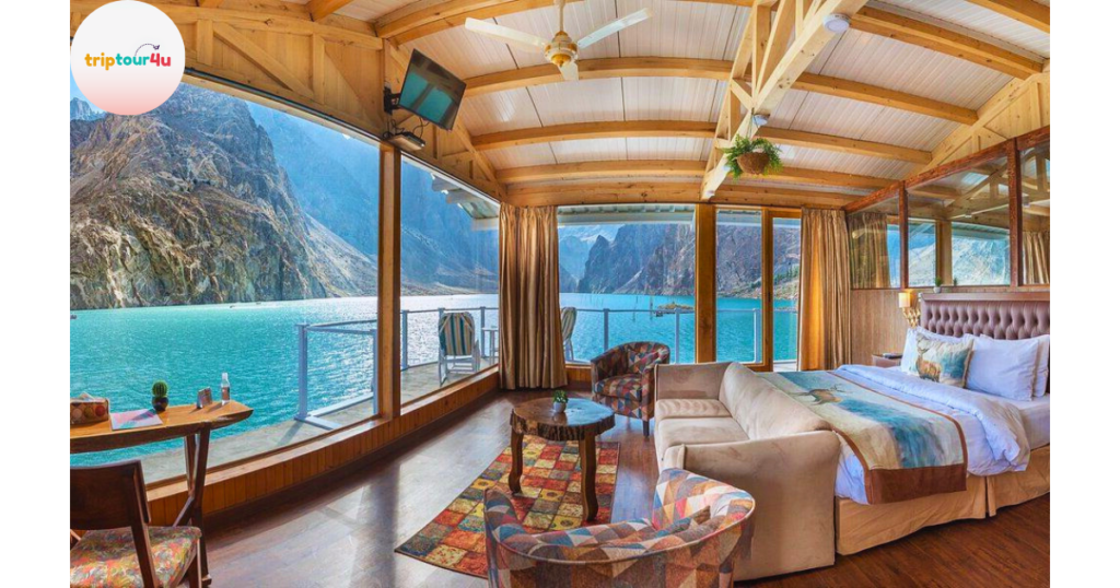 “Luxus Hunza resort overlooking Attabad Lake, featuring modern cliffside cabins with turquoise water and mountain views.”