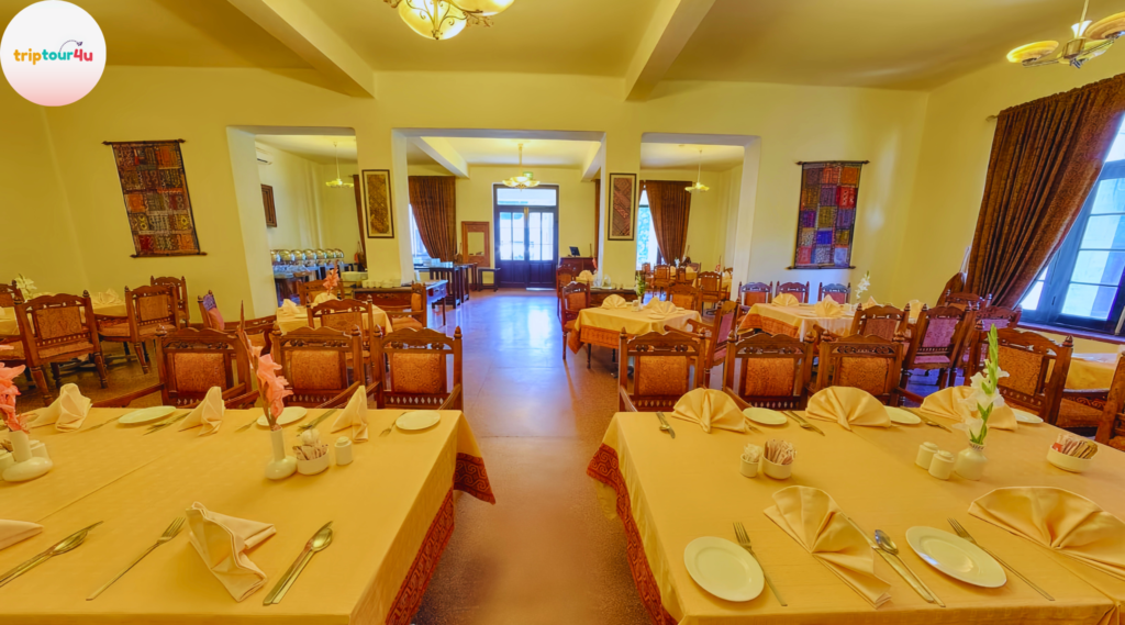 Dining hall of Swat Continental Hotel featuring neatly arranged tables, warm lighting, and a clean, comfortable atmosphere for guests.