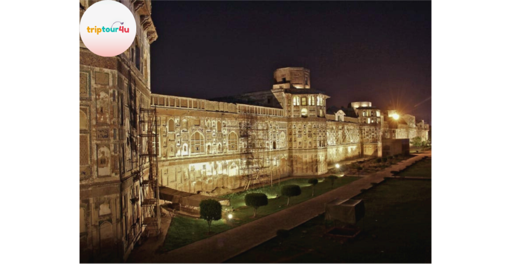 Night view of the Walled City Lahore featuring lit-up heritage buildings, vibrant streets, and cultural ambiance.