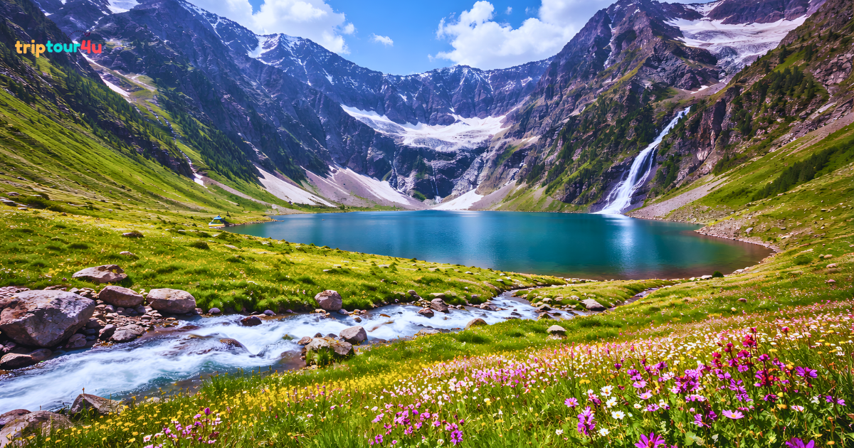 Scenic view of Sharda town in Neelum Valley, Pakistan, with the turquoise Neelum River, colorful riverside houses, and historic Sharda Peeth ruins.