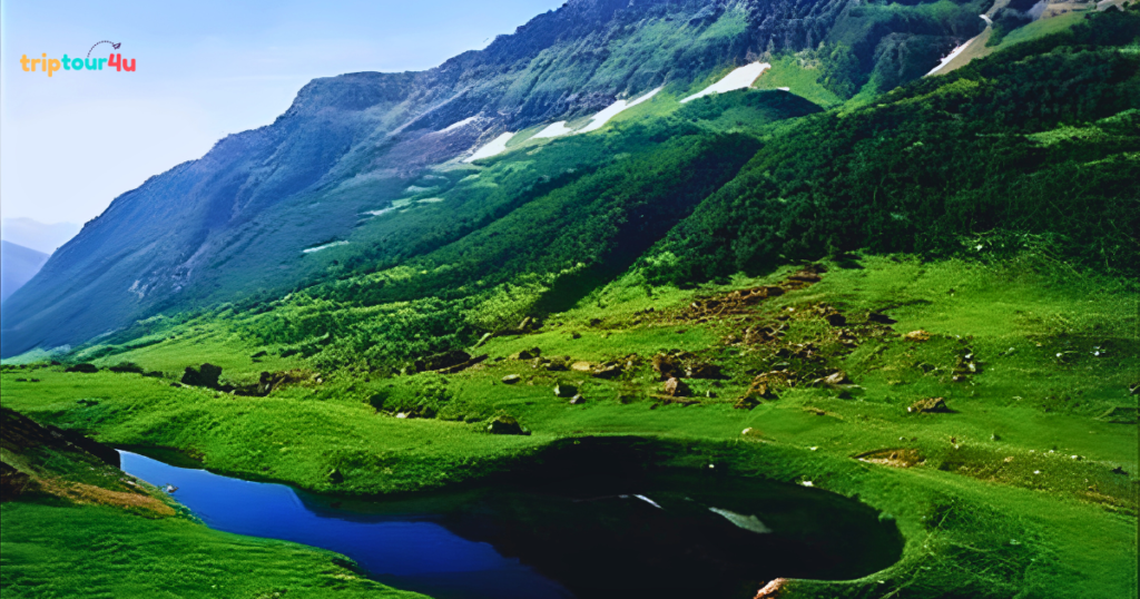 Shounter Lake in Neelum Valley, Pakistan, featuring clear turquoise alpine water surrounded by snow-capped peaks, rocky terrain, and untouched high-altitude scenery.