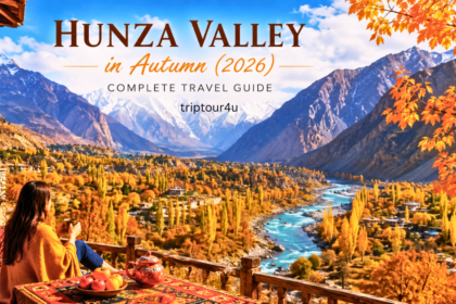 Panoramic view of Hunza Valley in Autumn 2026 with golden poplar trees, turquoise Hunza River, snow-capped Karakoram mountains, and a scenic mountain terrace.