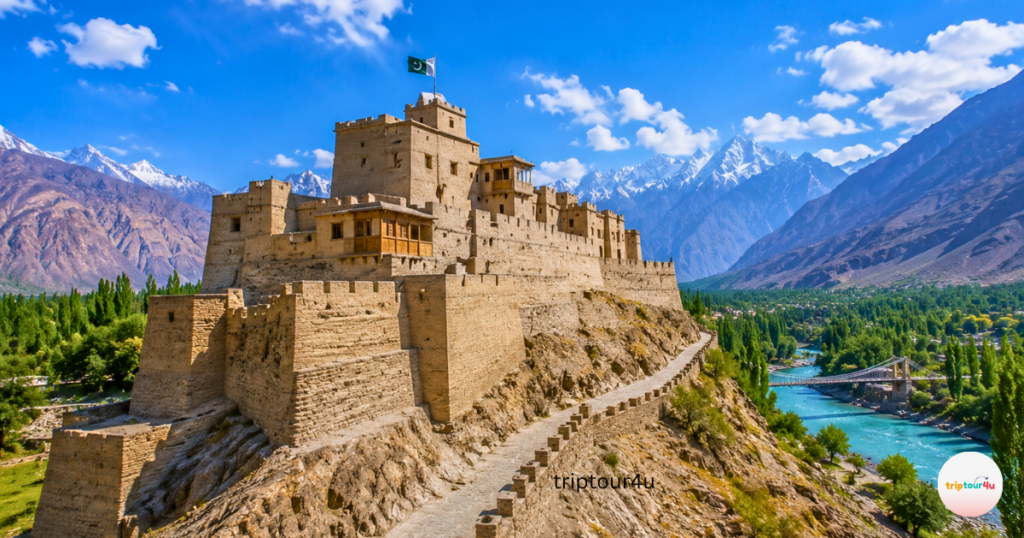Skardu after summer travel at Kharpocho Fort overlooking the Indus River, surrounded by golden poplar trees, rugged Karakoram mountains, and a clear blue autumn sky.