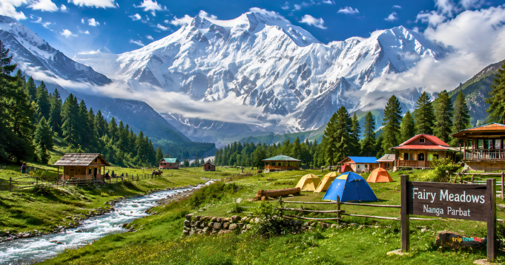 Fairy Meadows in Pakistan featuring lush green meadows, wooden cabins, colorful camping tents, a crystal-clear stream, pine forests, and the majestic snow-capped Nanga Parbat under a bright blue sky.