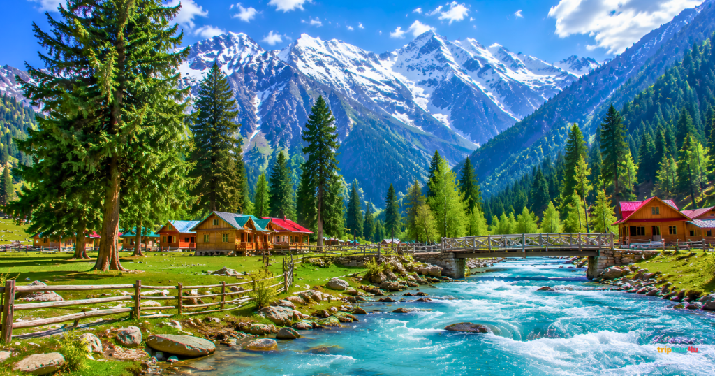 Kumrat Valley in Pakistan featuring a crystal-clear turquoise river, wooden cabins, lush pine forests, a rustic bridge, and snow-capped mountains under a bright blue sky.